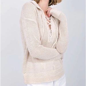 Lace up transitional cotton sweater .